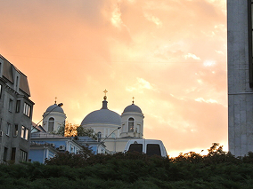 City with blue chapel on the hill
